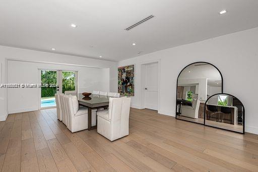 unfurnished dining area with french doors and light hardwood / wood-style flooring