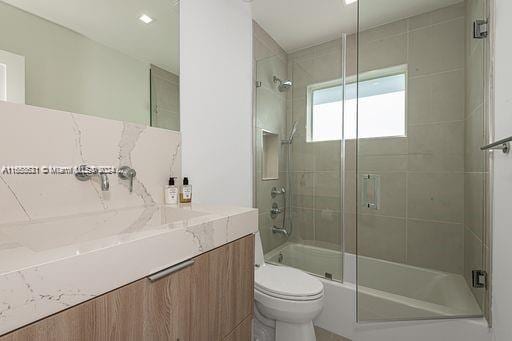 5231 SW 65th Ave, South Miami, FL 33155 - bathroom featuring vanity and enclosed tub / shower combo
