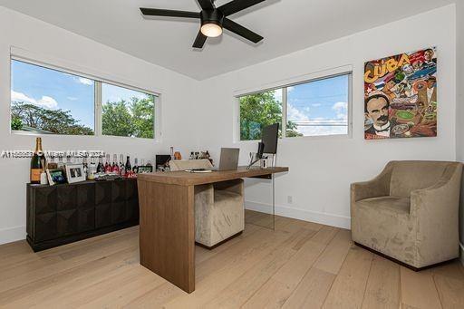 office area featuring ceiling fan and light hardwood / wood-style flooring