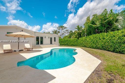 view of swimming pool featuring a patio area