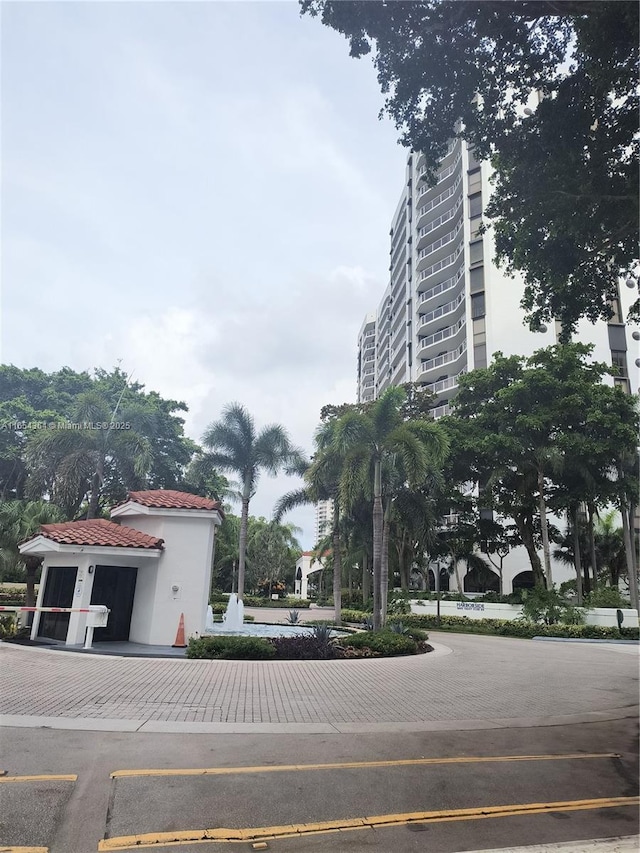 view of building exterior featuring uncovered parking