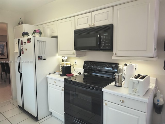 kitchen with black appliances, light tile patterned floors, white cabinetry, and light countertops