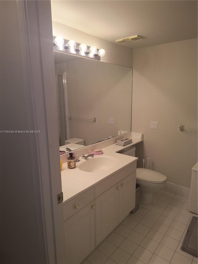 full bathroom with visible vents, toilet, vanity, tile patterned flooring, and baseboards