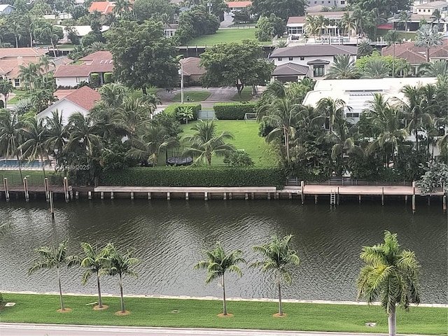 exterior space featuring a water view and a residential view