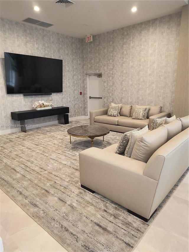 living room featuring visible vents and recessed lighting