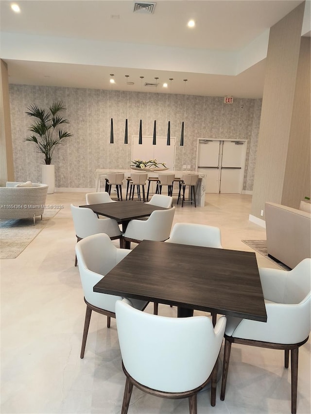 dining area with recessed lighting, visible vents, baseboards, and wallpapered walls