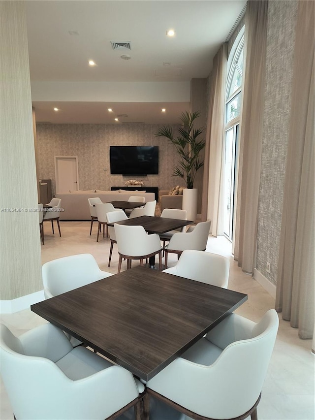 dining area with recessed lighting, visible vents, baseboards, and wallpapered walls