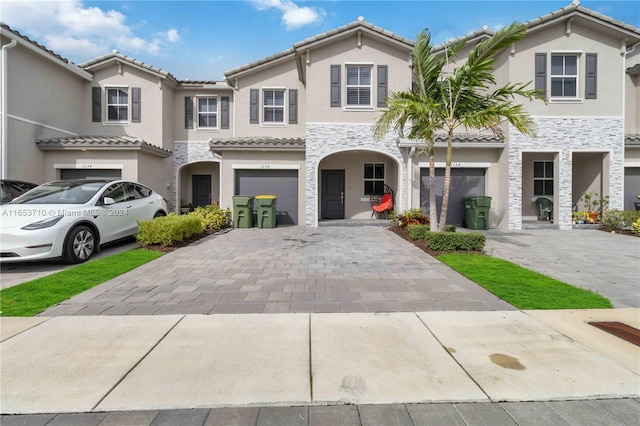 view of front of home with a garage