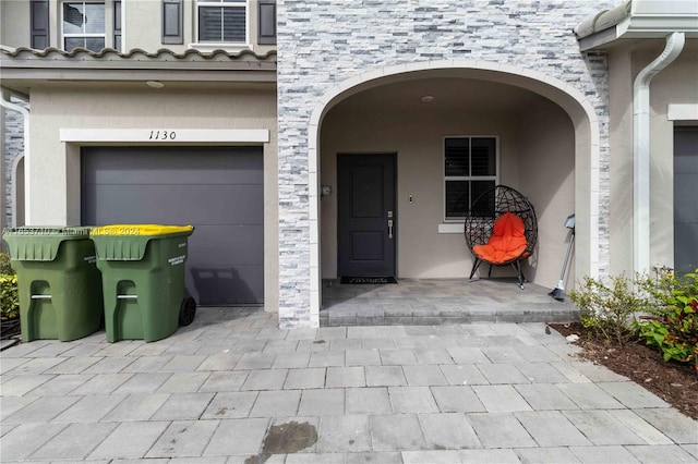 property entrance featuring a garage