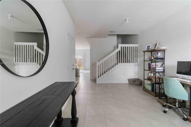 hallway featuring light tile patterned floors