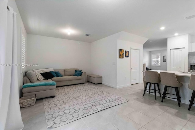 living room featuring light tile patterned flooring