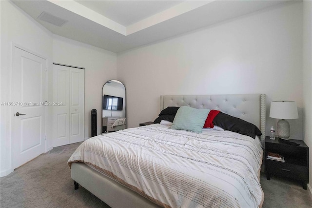 bedroom featuring a closet and carpet floors