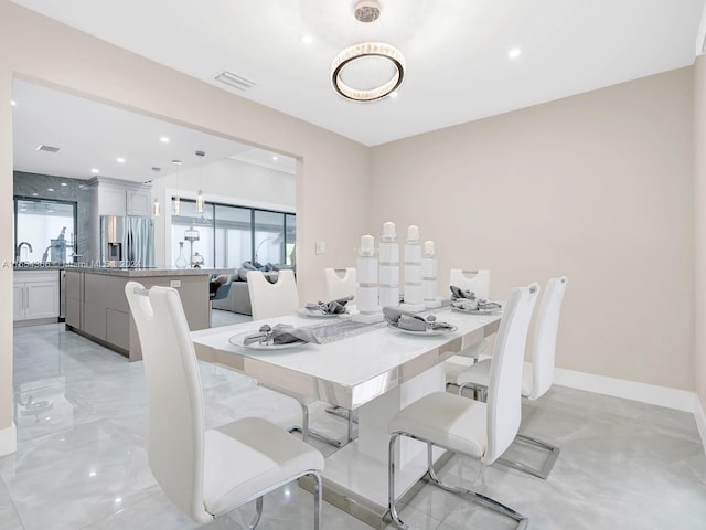 dining area with a healthy amount of sunlight and sink