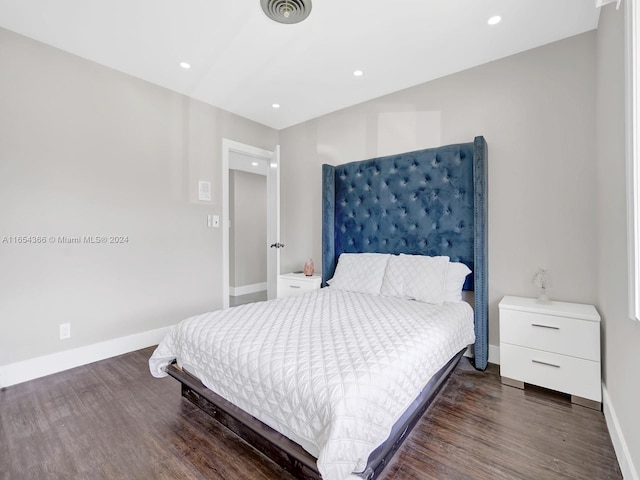 bedroom featuring dark hardwood / wood-style flooring