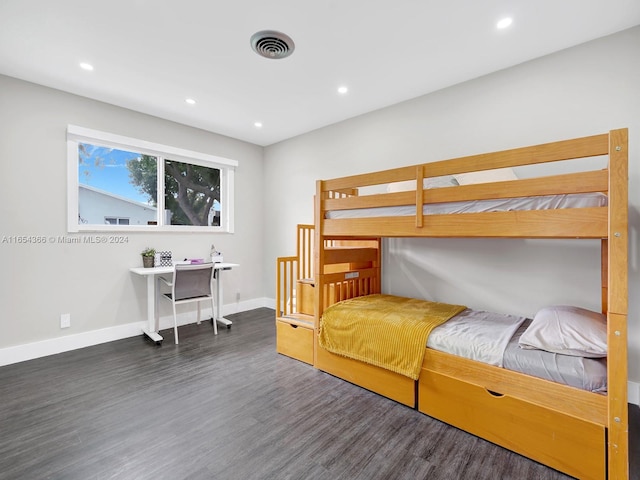 bedroom with dark wood-type flooring