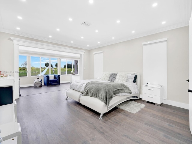 bedroom featuring ornamental molding and wood-type flooring