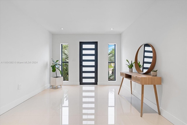 entrance foyer with light tile patterned floors