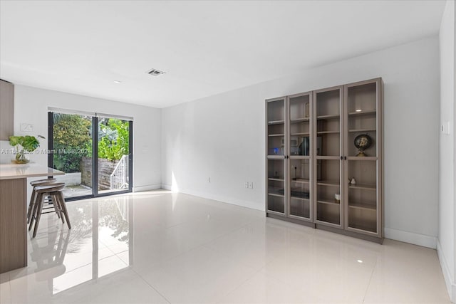 interior space with light tile patterned floors