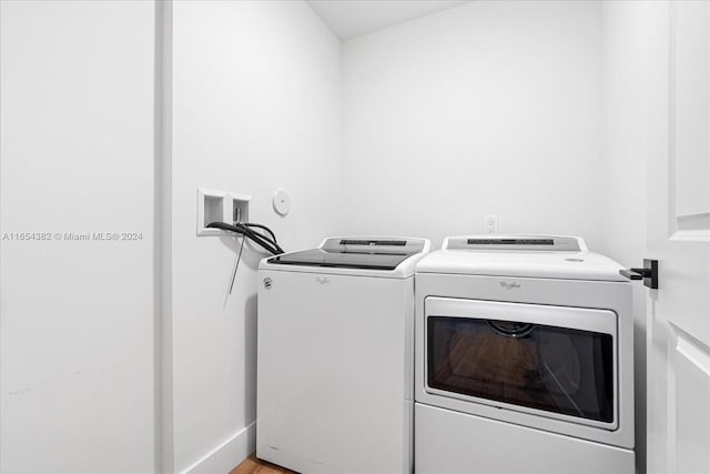 laundry area with separate washer and dryer