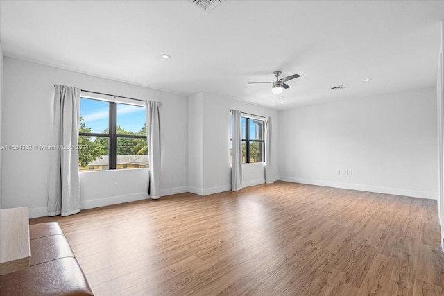 spare room featuring ceiling fan and hardwood / wood-style floors