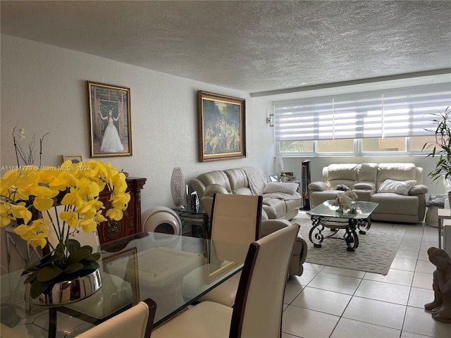 tiled dining room with a textured ceiling