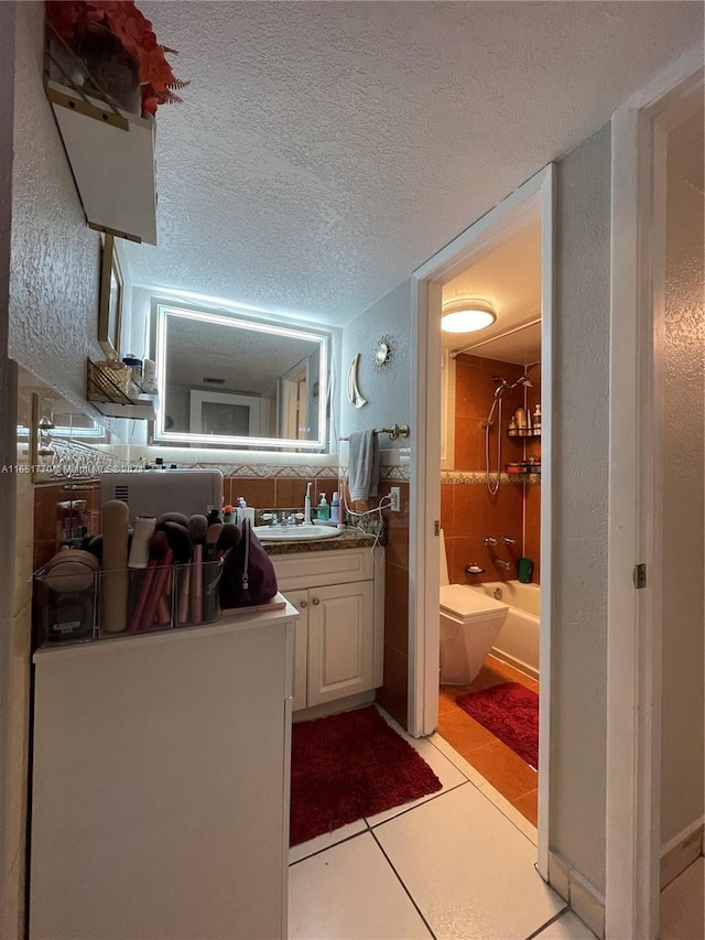 bathroom with vanity and tile walls