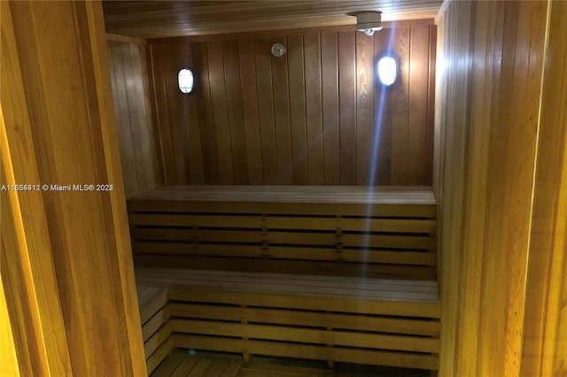 view of sauna with wooden walls