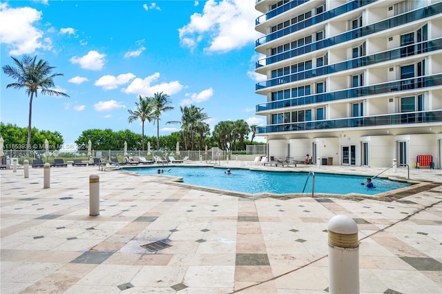 view of swimming pool featuring a patio area