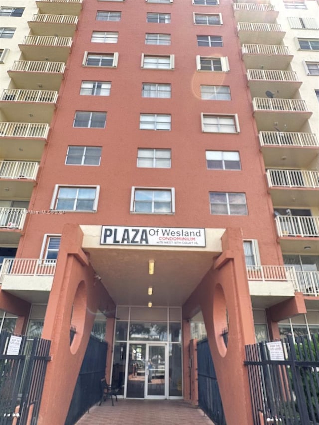 view of building exterior with fence