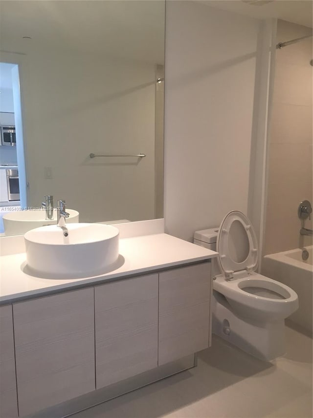 full bathroom with vanity, toilet, and bathtub / shower combination