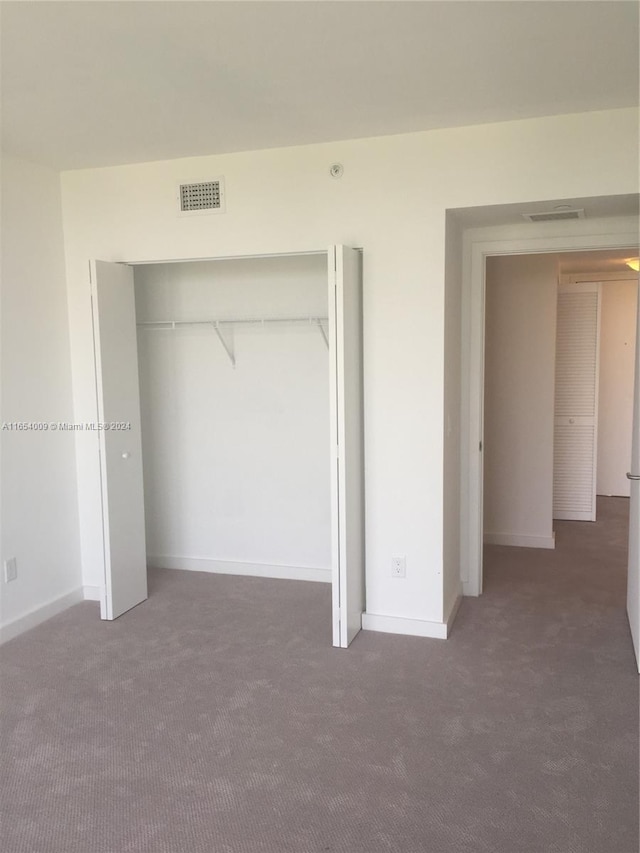4250 Biscayne Blvd Unit 1211, Miami, FL 33137 - unfurnished bedroom with carpet flooring and a closet