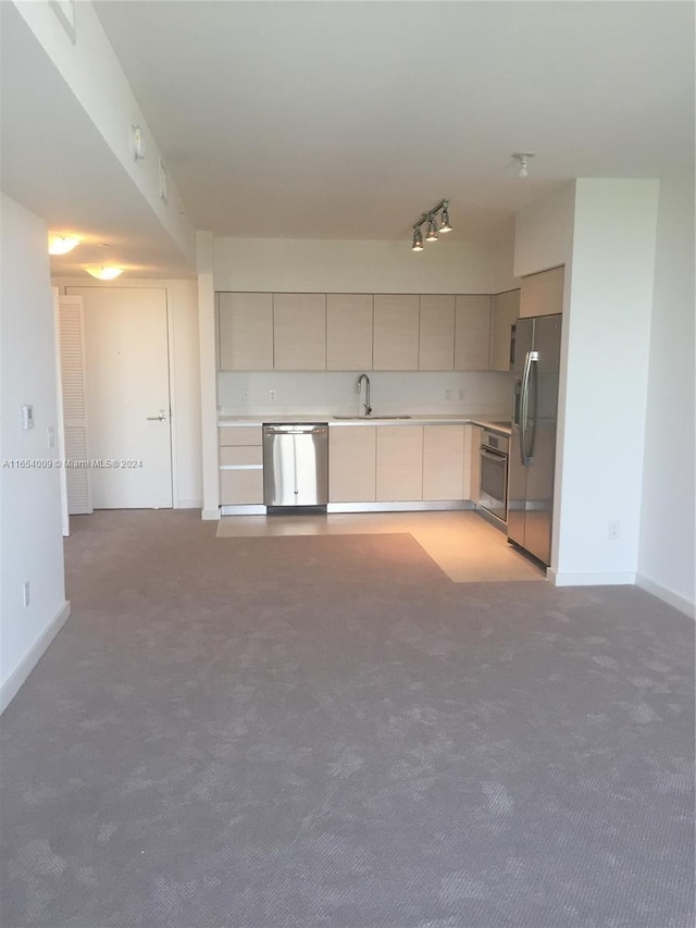 4250 Biscayne Blvd Unit 1211, Miami, FL 33137 - kitchen featuring stainless steel appliances, light countertops, gray cabinetry, and light colored carpet