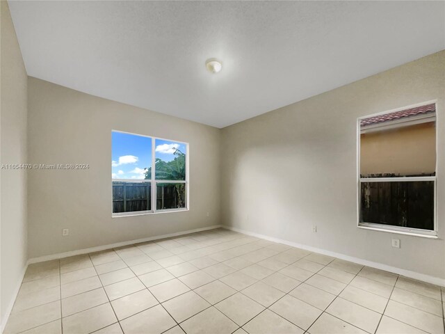 view of tiled spare room