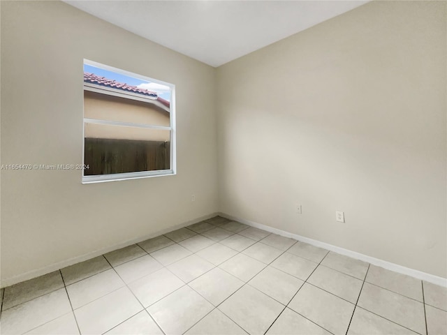 spare room with light tile patterned floors