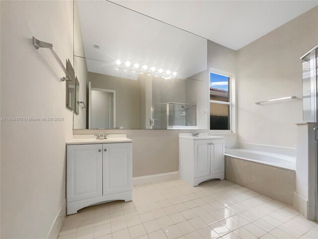 bathroom featuring vanity, tile patterned floors, and shower with separate bathtub