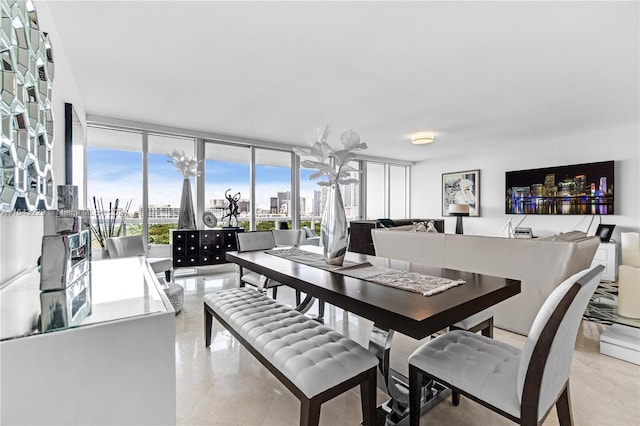 dining area featuring floor to ceiling windows