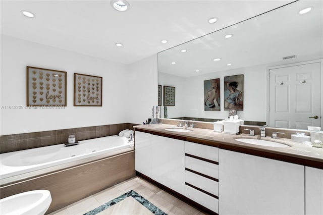 bathroom featuring vanity, a bathing tub, and tile patterned flooring