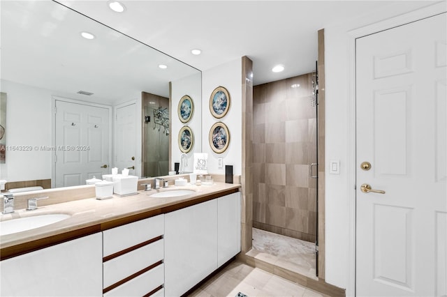 bathroom featuring vanity and a shower with shower door