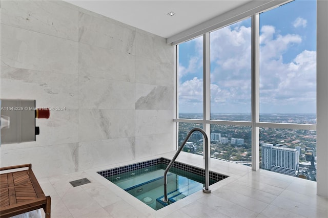 view of pool featuring an indoor hot tub