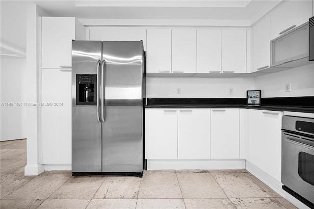 kitchen with stainless steel appliances and white cabinets