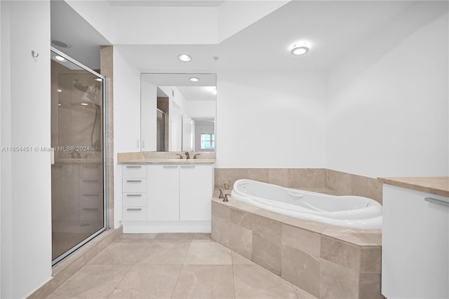 bathroom featuring tile patterned flooring, vanity, and independent shower and bath