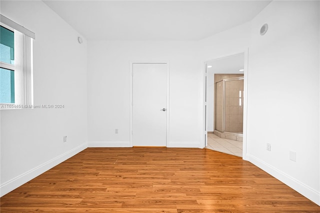 spare room featuring light wood-type flooring