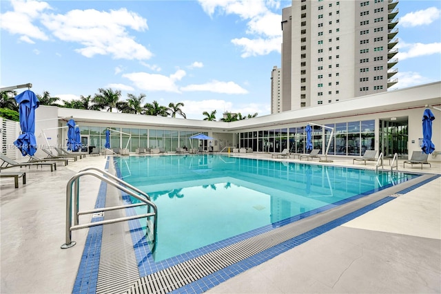 view of swimming pool with a patio area