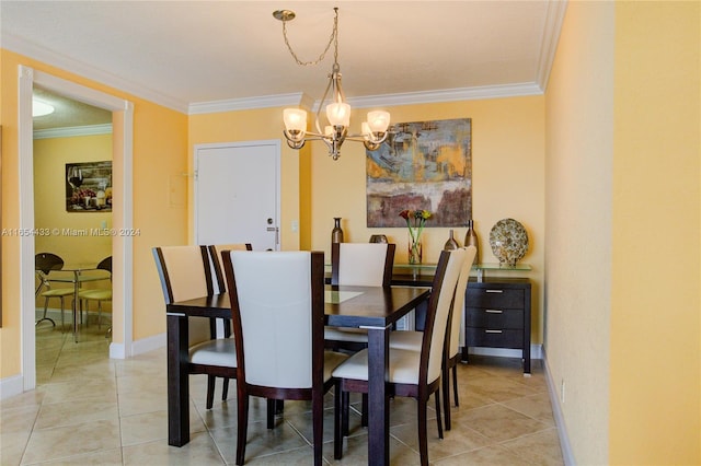 tiled dining area with crown molding and an inviting chandelier