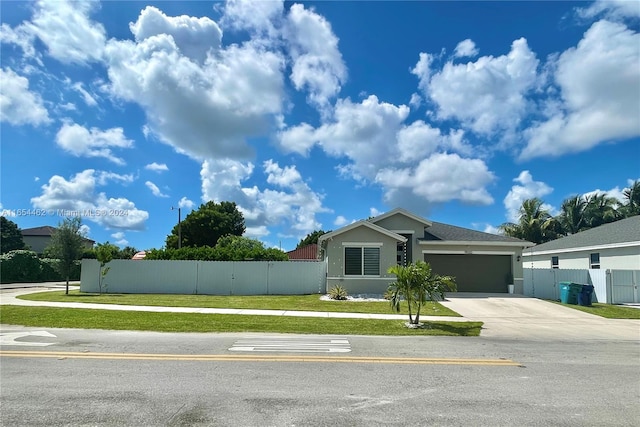 view of front of home featuring a garage and a front yard