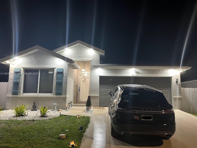 view of front of property with a garage