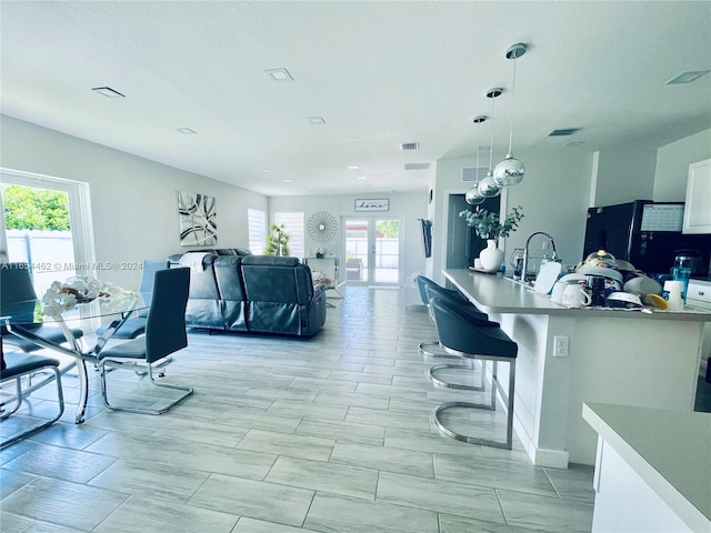 interior space with sink and french doors