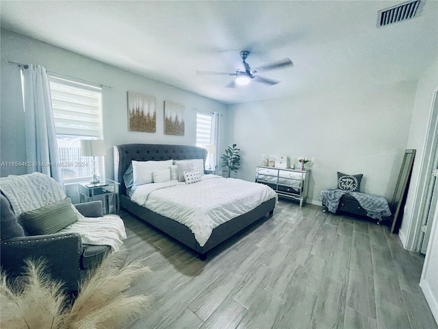 bedroom featuring ceiling fan and light hardwood / wood-style flooring