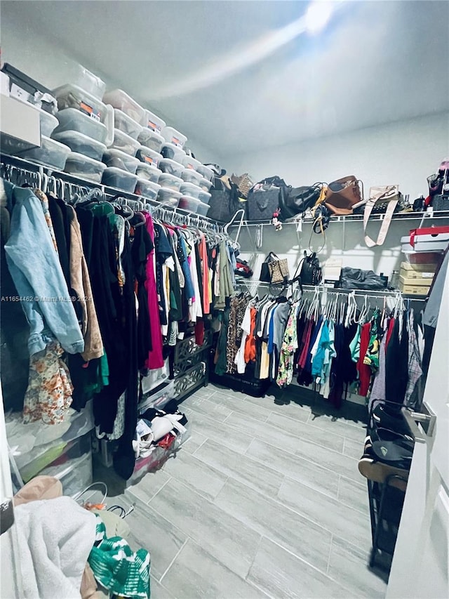 spacious closet featuring hardwood / wood-style flooring