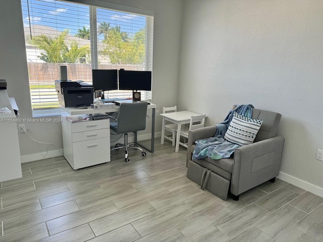 office with light hardwood / wood-style flooring